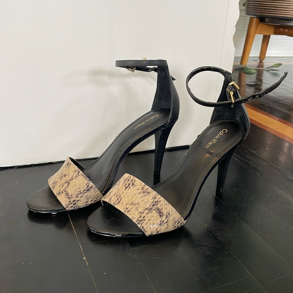 I’m selling a Calvin Klein black and snake skin high heel size 8.5 in women’s.